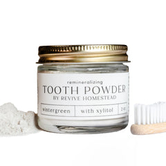 2 oz amber glass jar of hydroxyapatite tooth powder with peppermint label