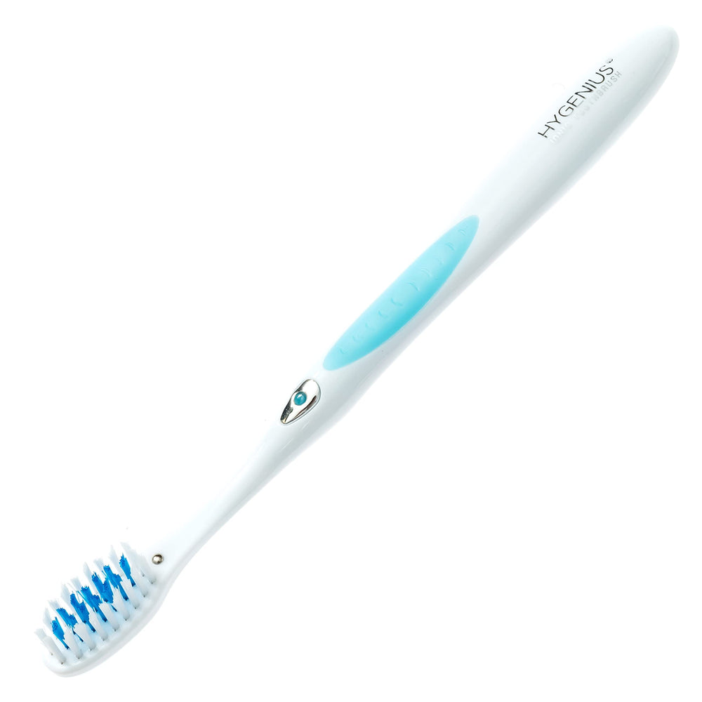 Toothbrush positioned near teeth to demonstrate cleaning action