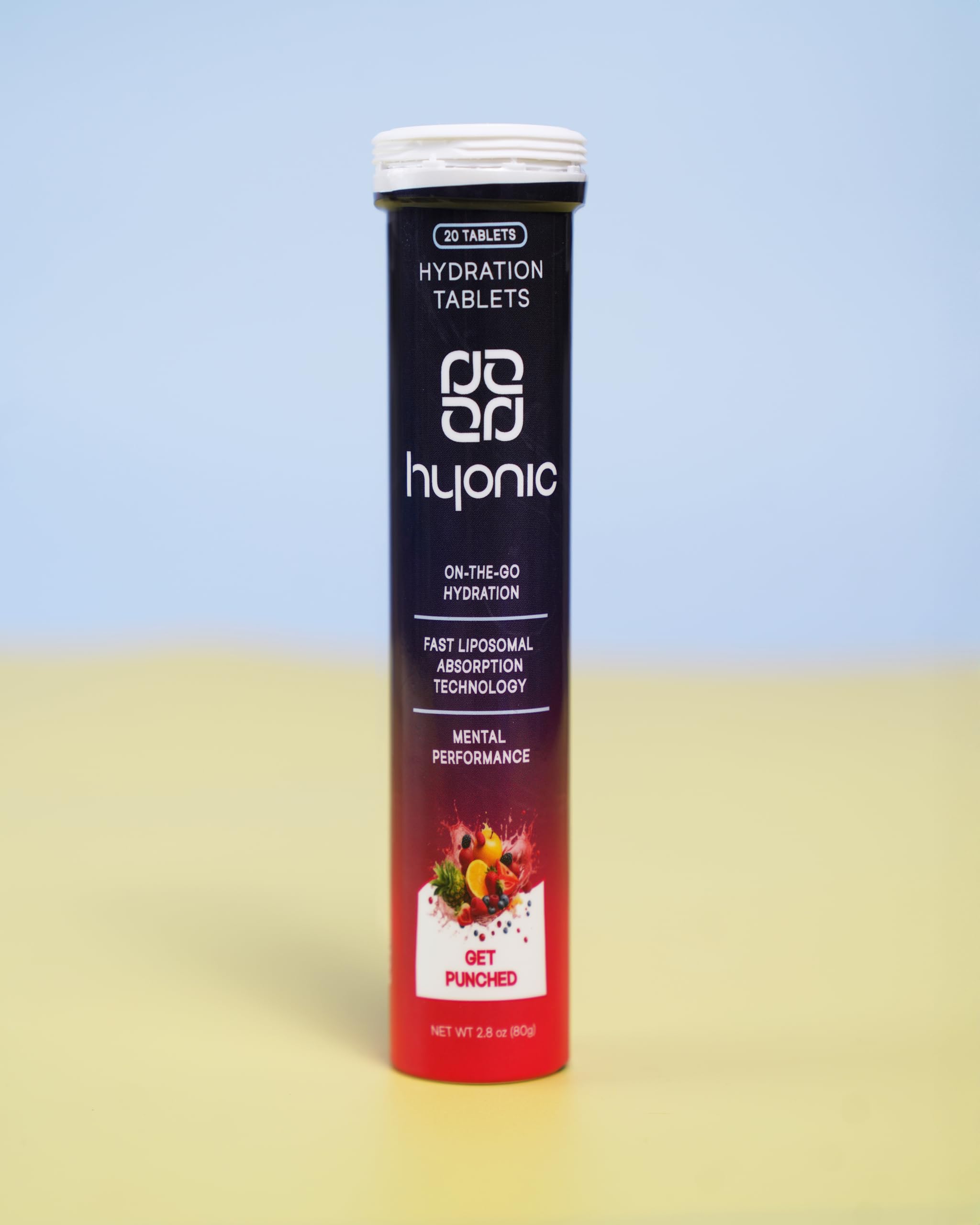 Pouring a Hyonic tablet into a glass of water