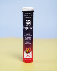 Pouring a Hyonic tablet into a glass of water