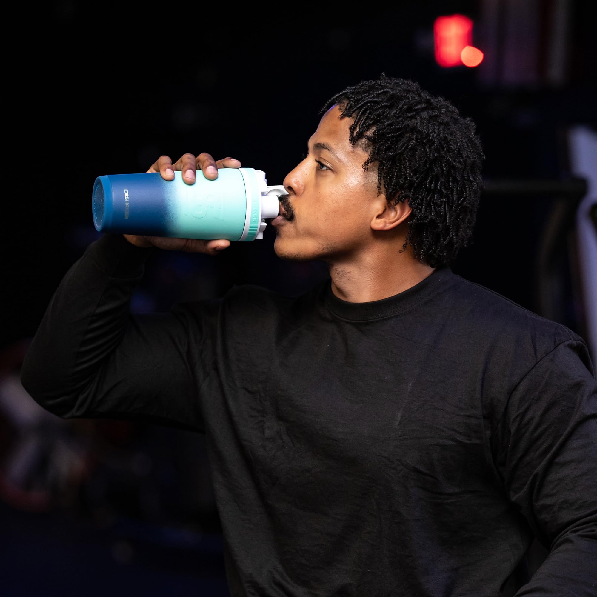 Ice Shaker 26oz Navy Mint fits standard cup holders for easy transport.