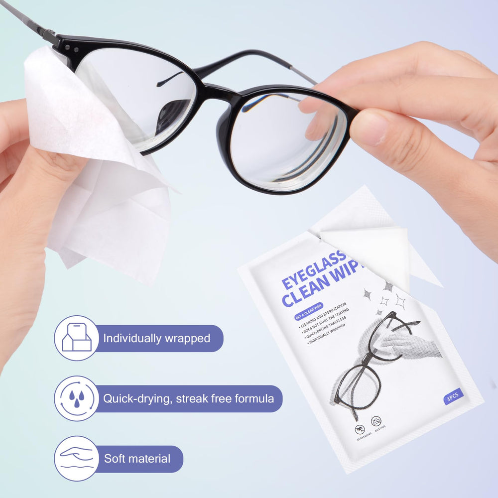 Close-up of a cleaning wipe being used on eyeglasses