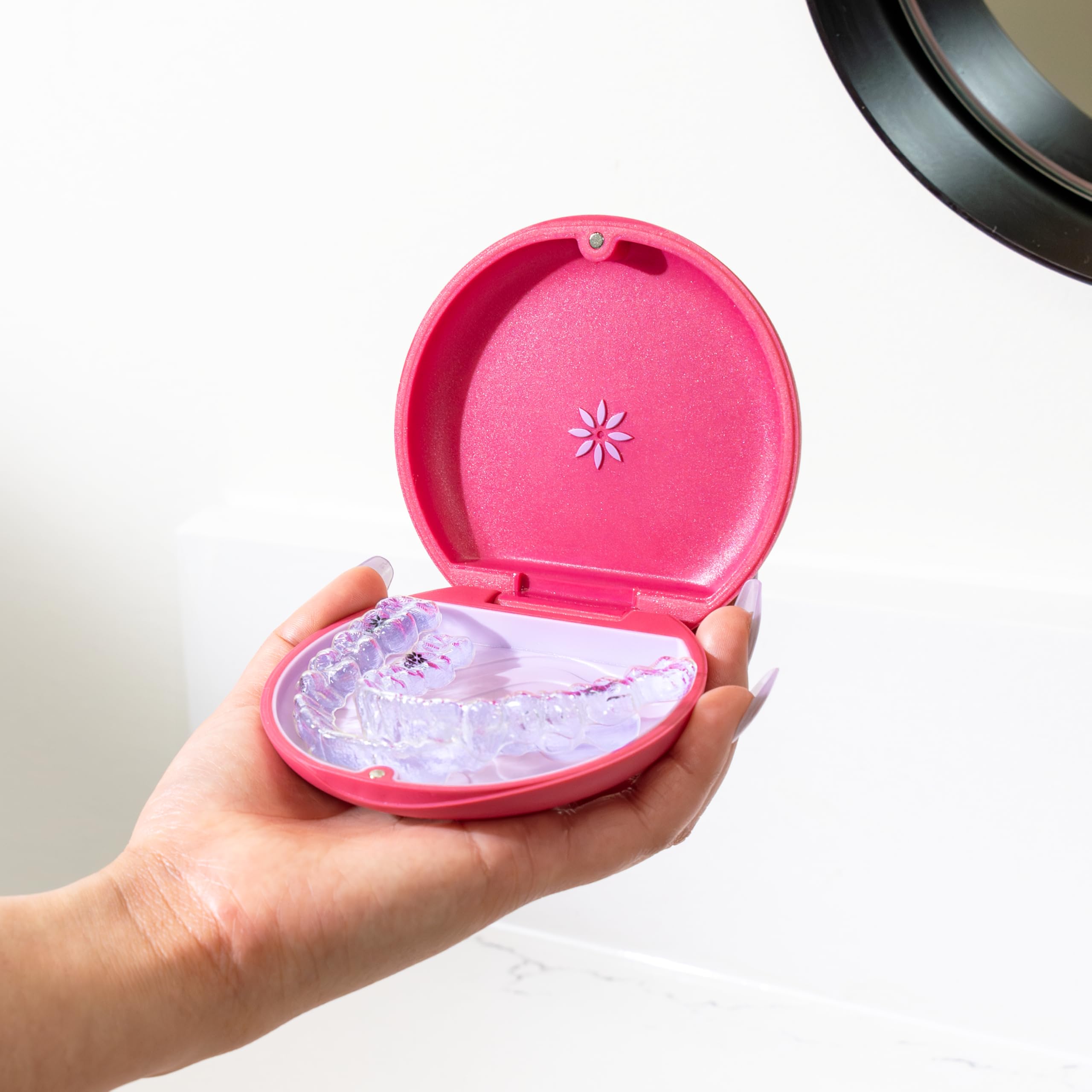 Official Invisalign case branding in magenta