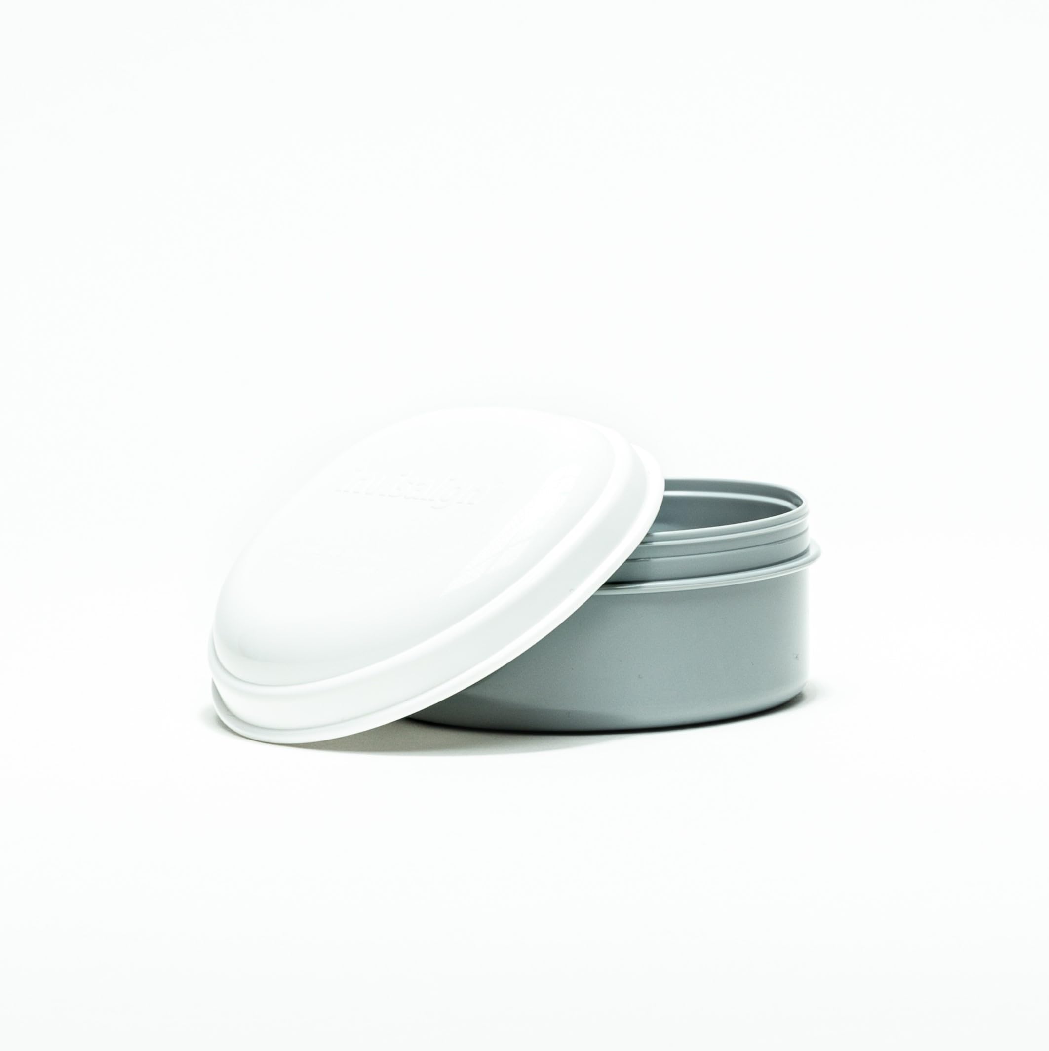Aligners soaking in Invisalign Cleaning System+ solution