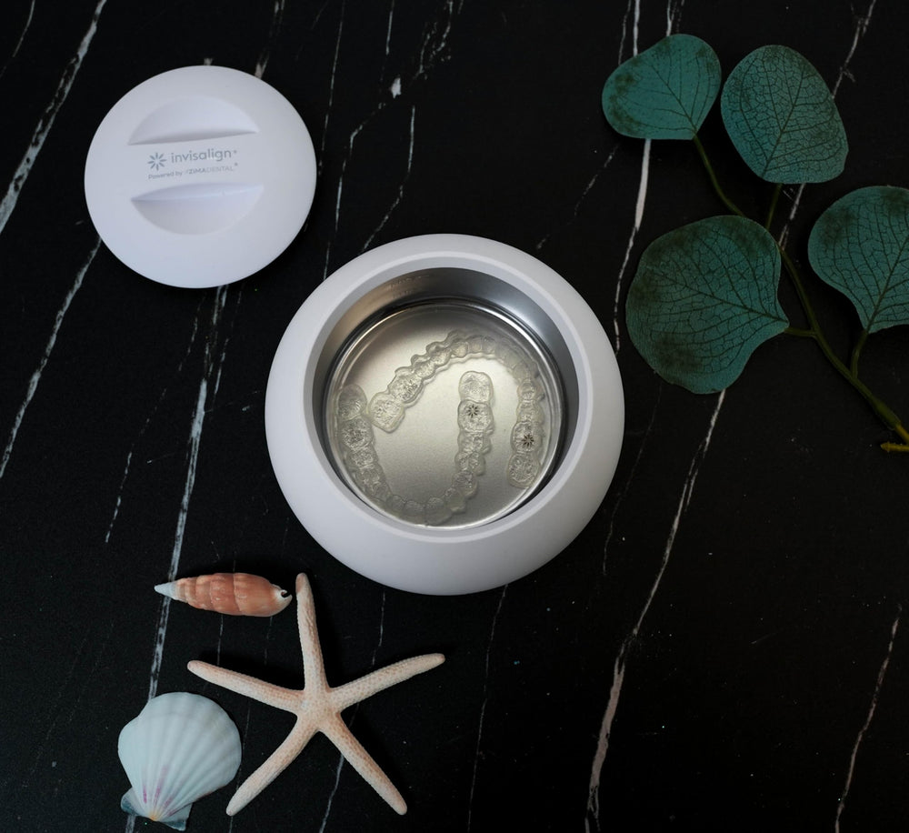 Product packaging and Arctic White finish of Invisalign Ultrasonic Cleaner