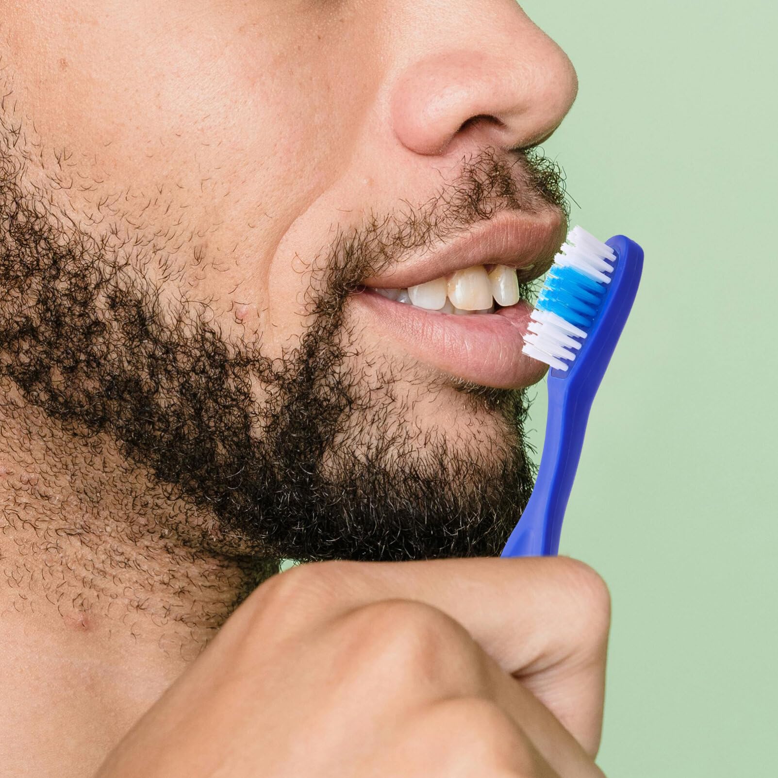 Close-up of 9cm mini toothbrush showing soft bristles
