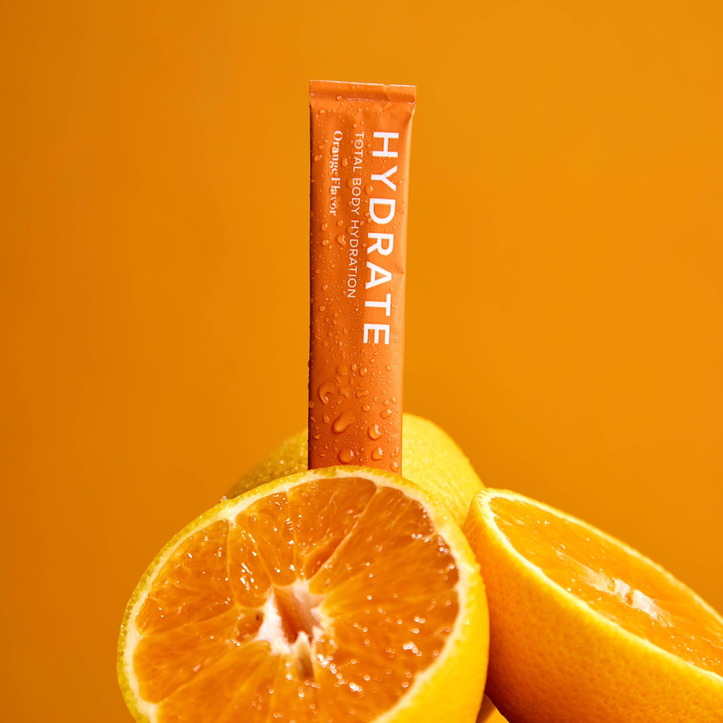 Isagenix Hydrate powder in a glass highlighting dissolved hydration mix