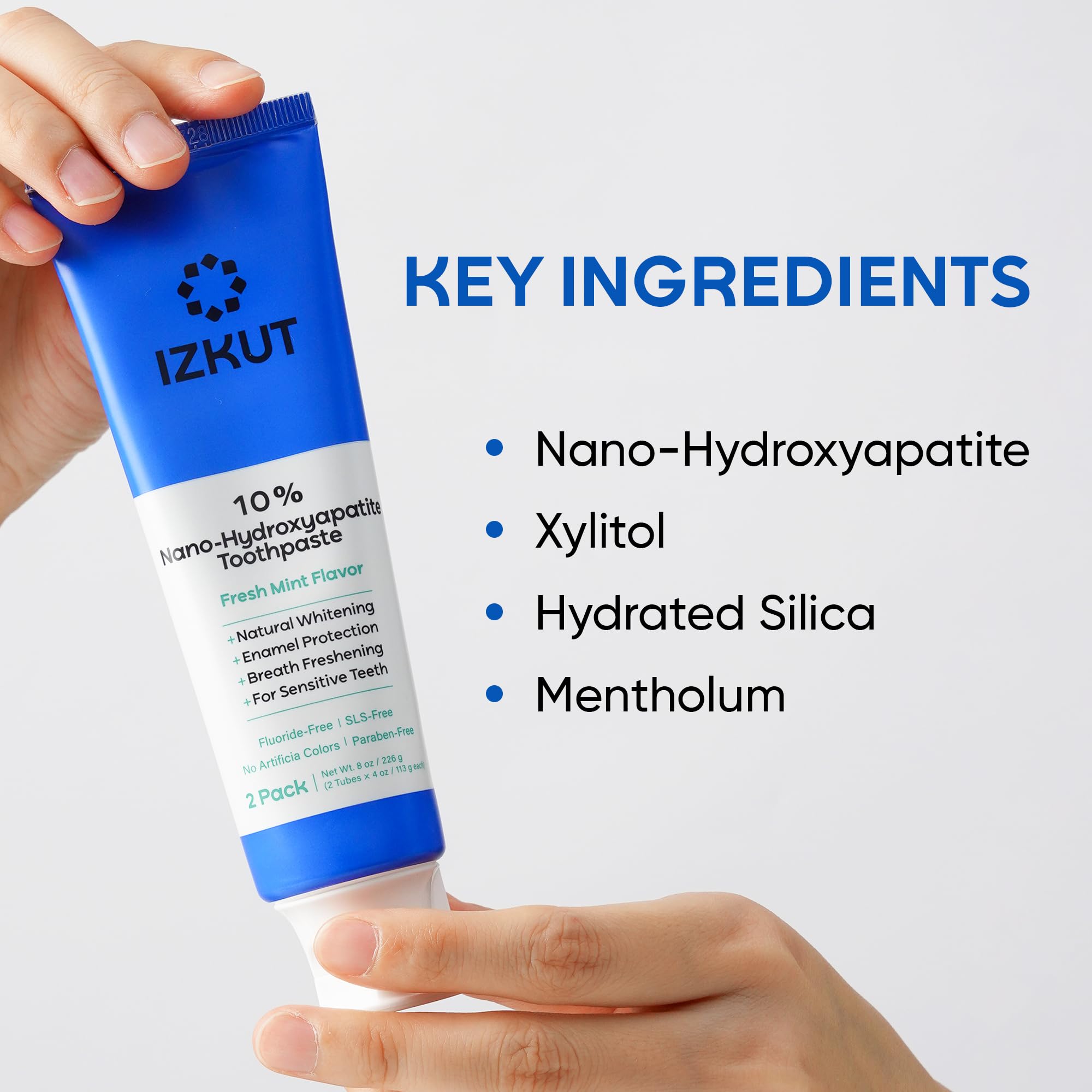 Front-facing shot of IZKUT toothpaste packaging