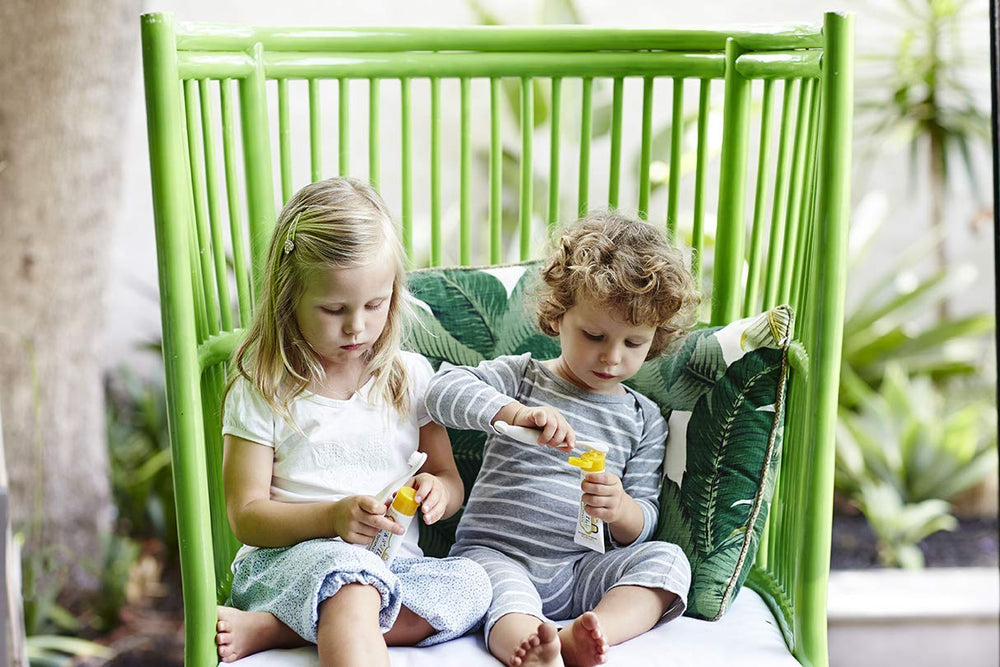 Child brushing teeth with Jack N' Jill Banana toothpaste