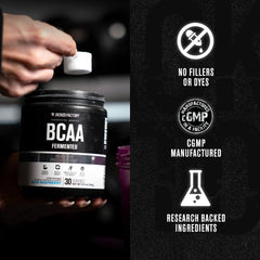 Scoop pouring BCAA powder into a shaker
