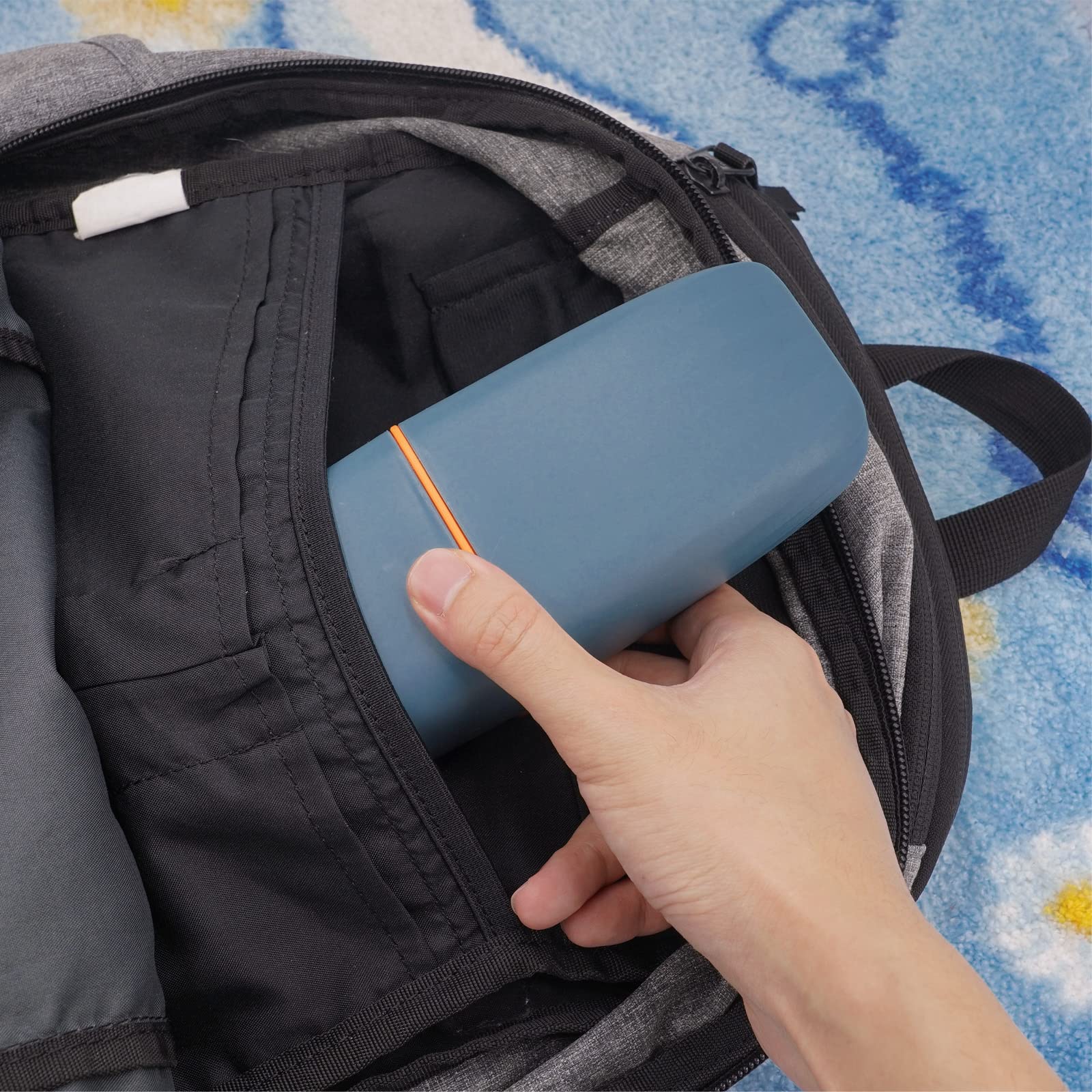 Travel toothbrush case opened showing two compartments