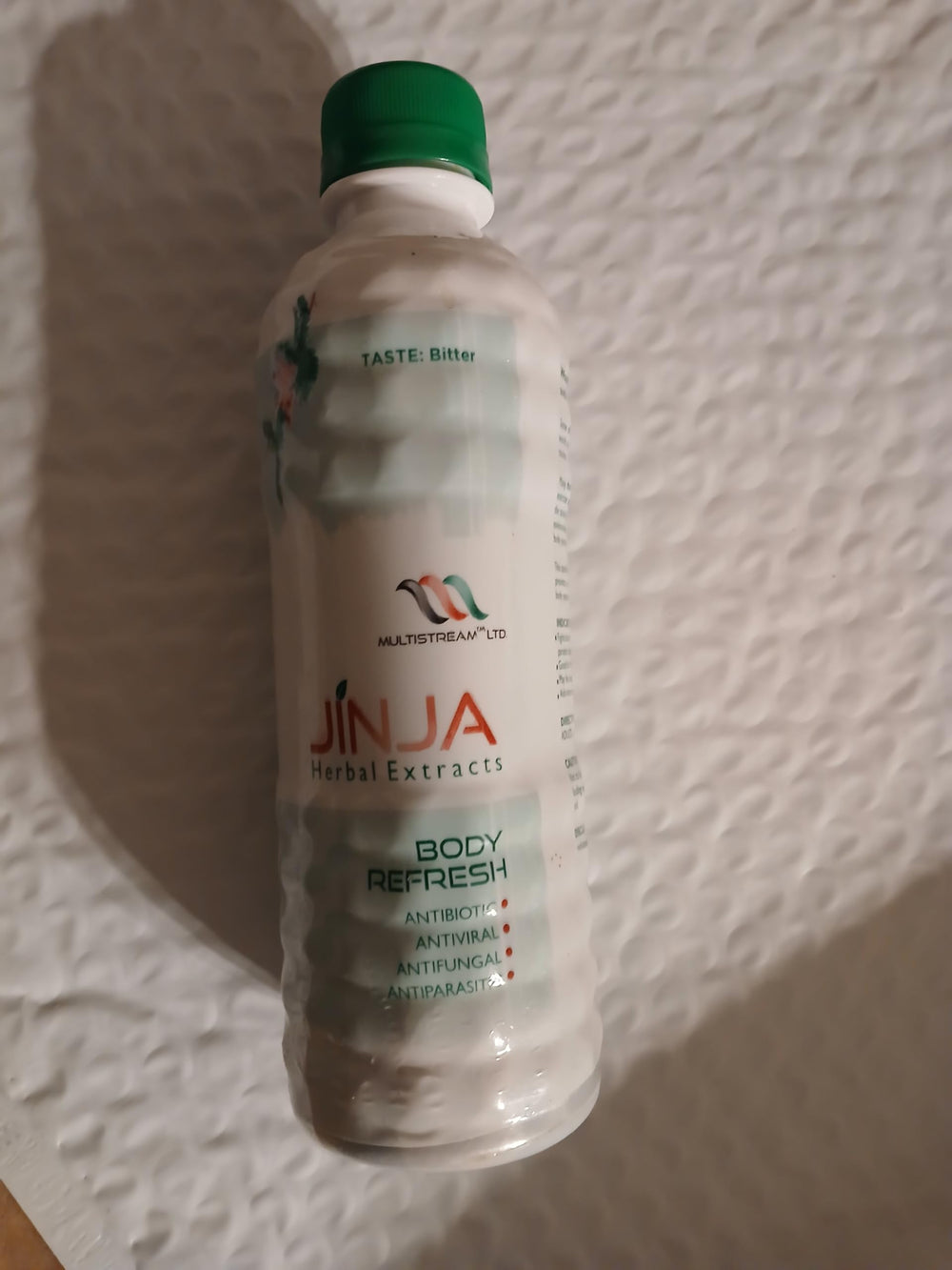 Jinja Herbal Extract packaging and bottle on white background
