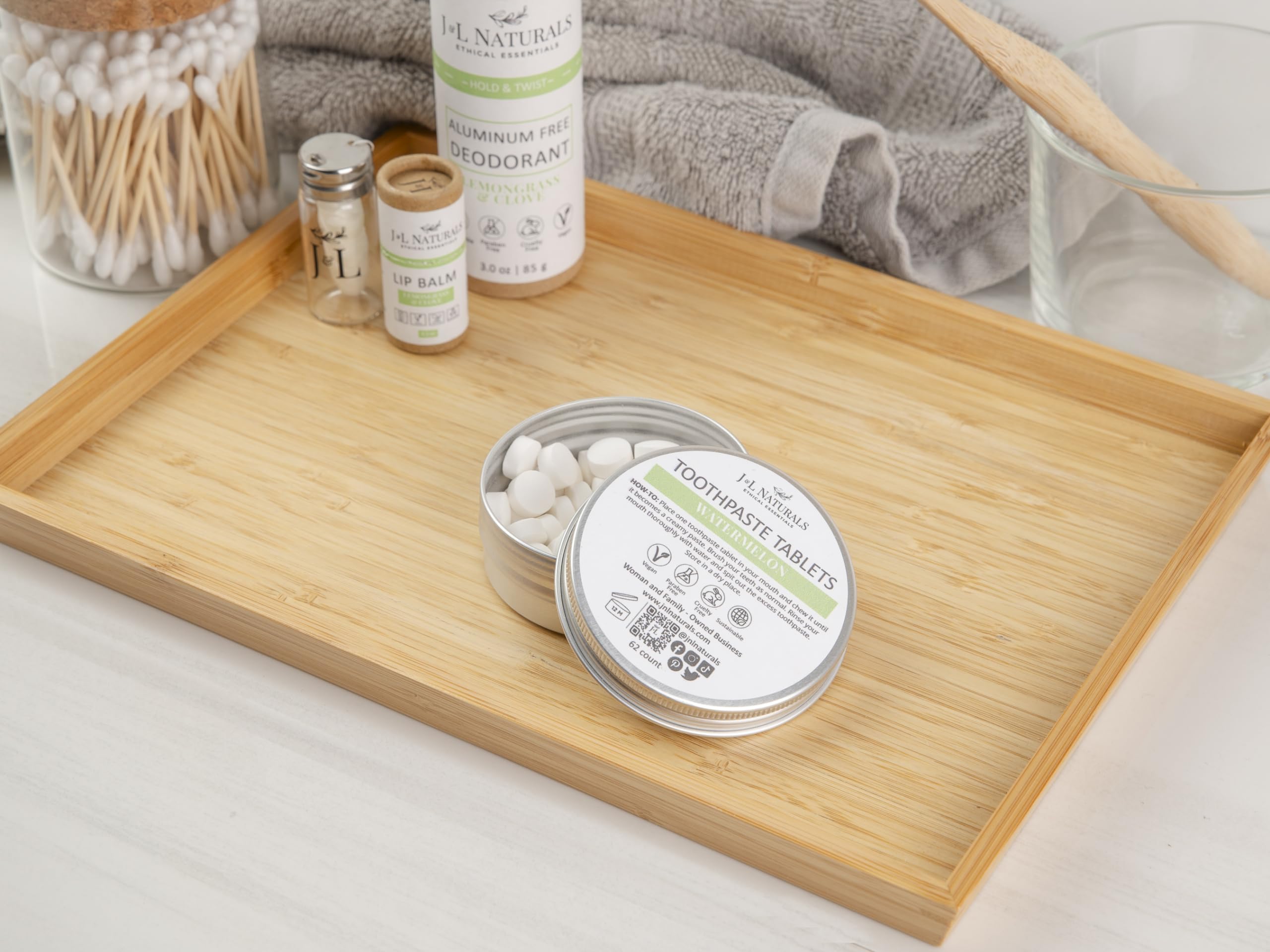 Woman-owned small business logo and toothpaste tablets