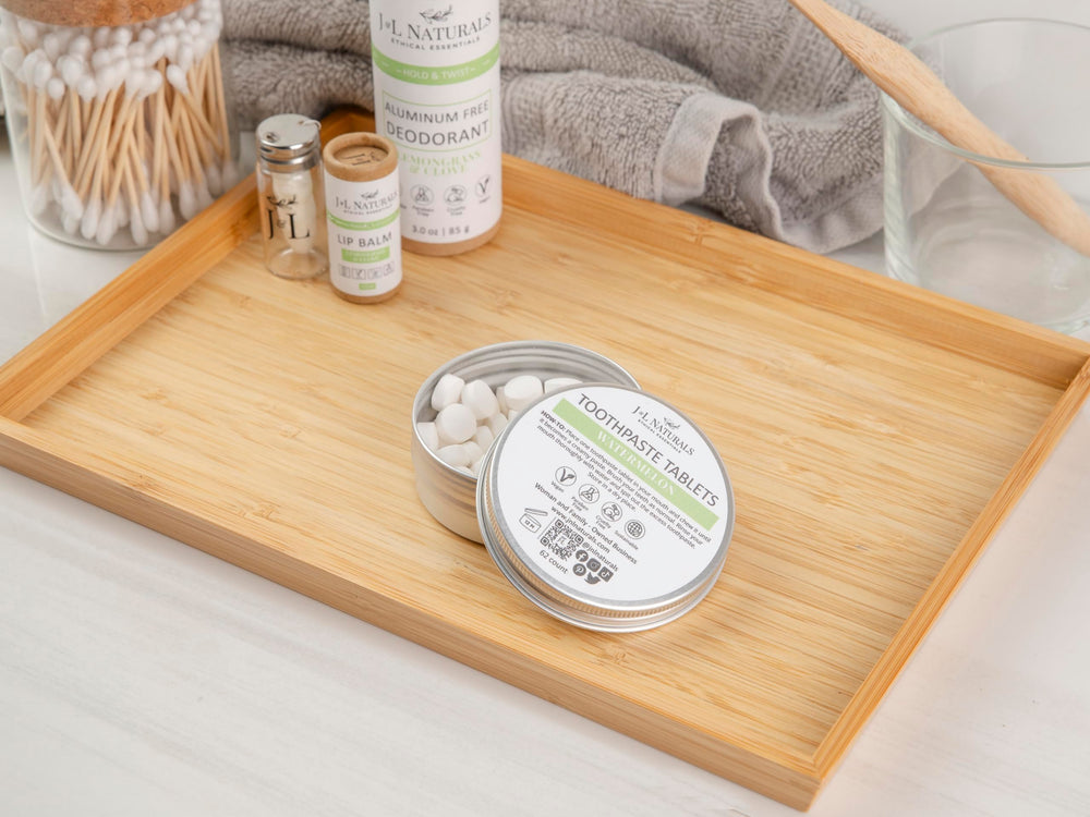 Woman-owned small business logo and toothpaste tablets