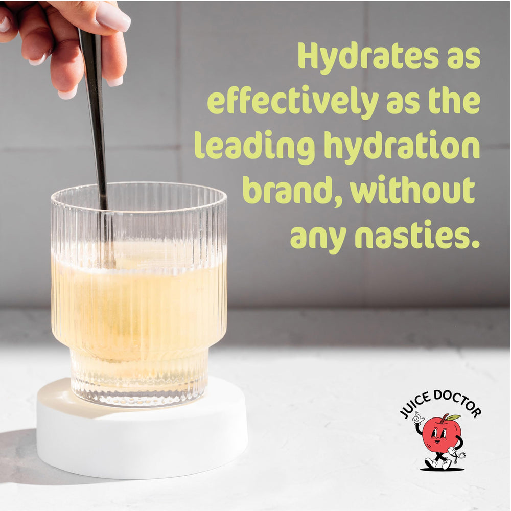 Powder being poured into a glass of water for hydration