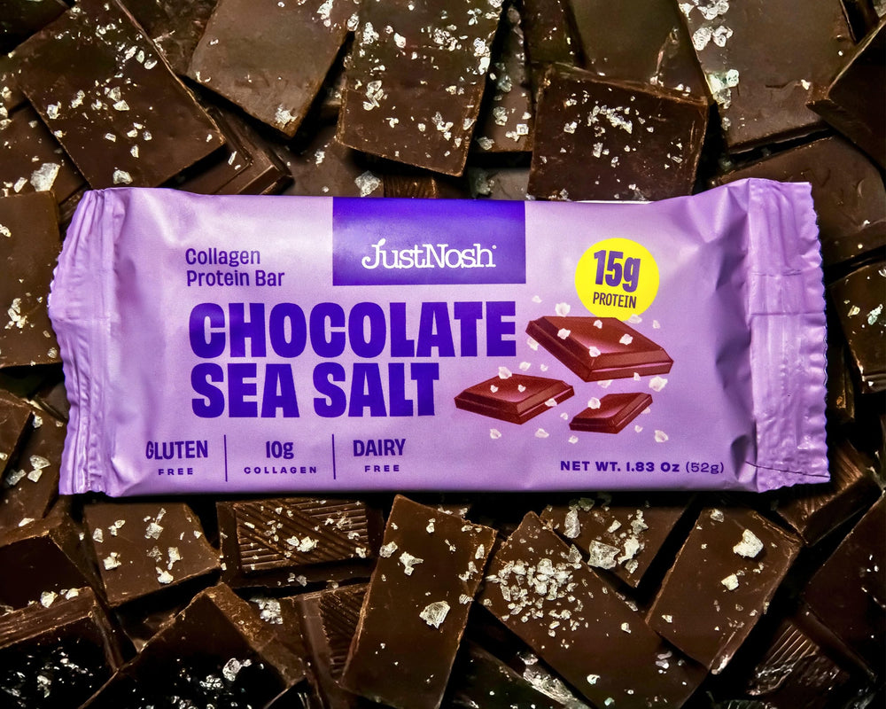 12-pack box of JUSTNOSH Chocolate Sea Salt Collagen Protein Bars