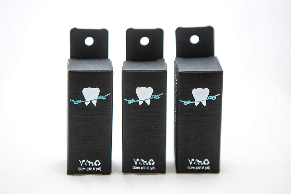 Close-up of bamboo charcoal floss with grapefruit seed extract and mint