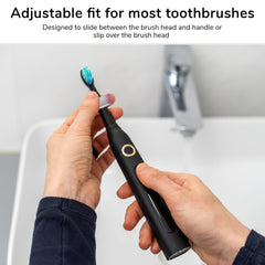 Drip Dodger being slid between toothbrush head and handle for fit
