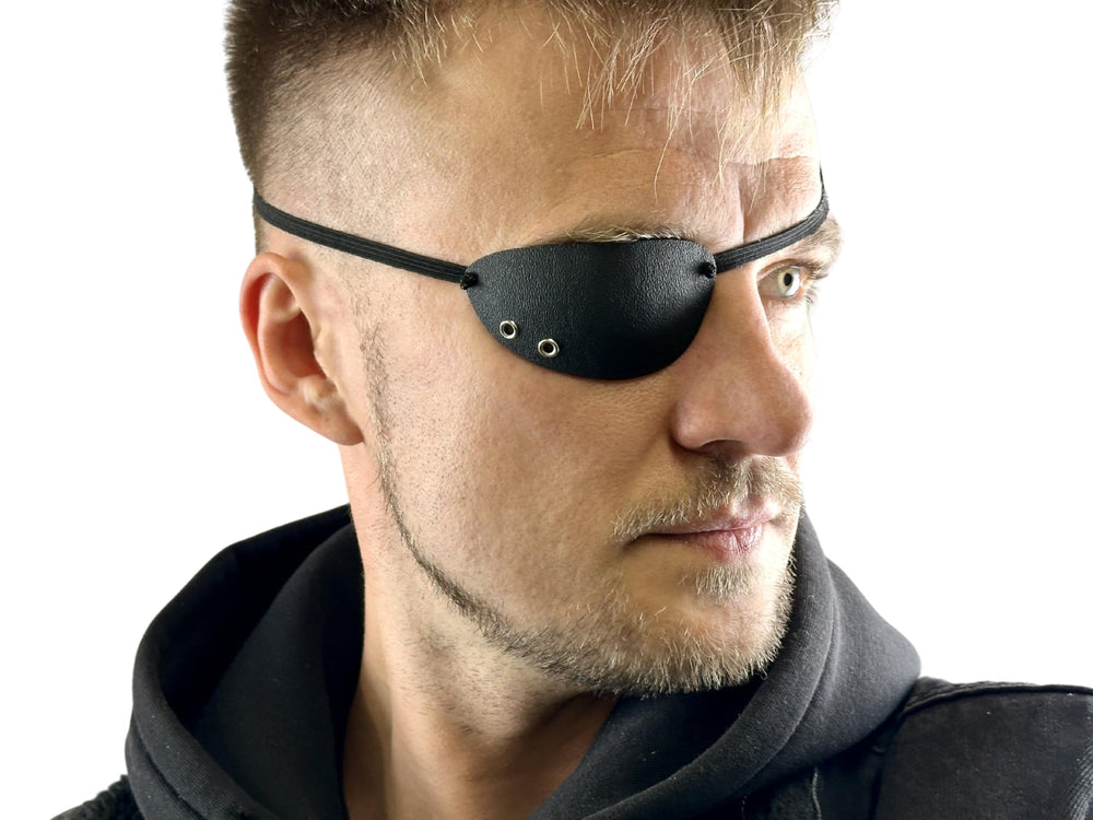 Black KYDEX eye patch for the right eye with foam padding and adjustable elastic band