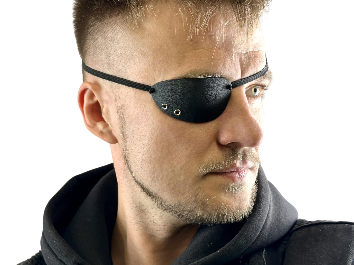 Black KYDEX eye patch for the right eye with foam padding and adjustable elastic band