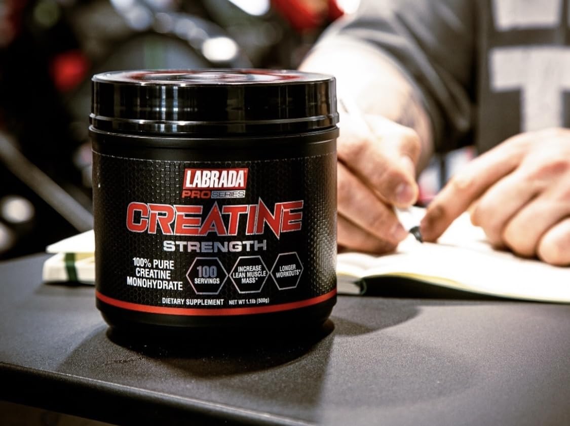 Creatine powder being mixed into a glass of water