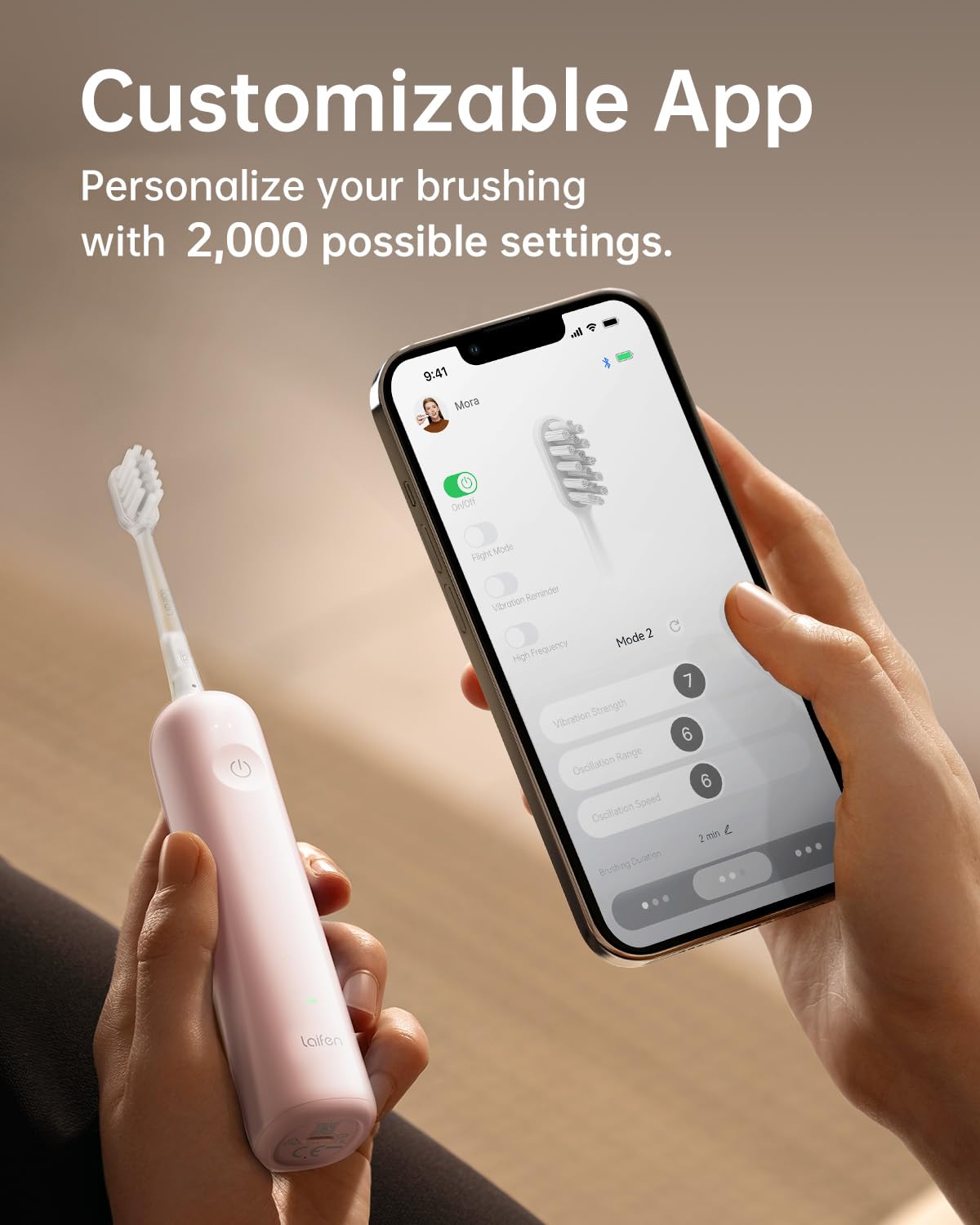 Pink Laifen Wave toothbrush held in hand
