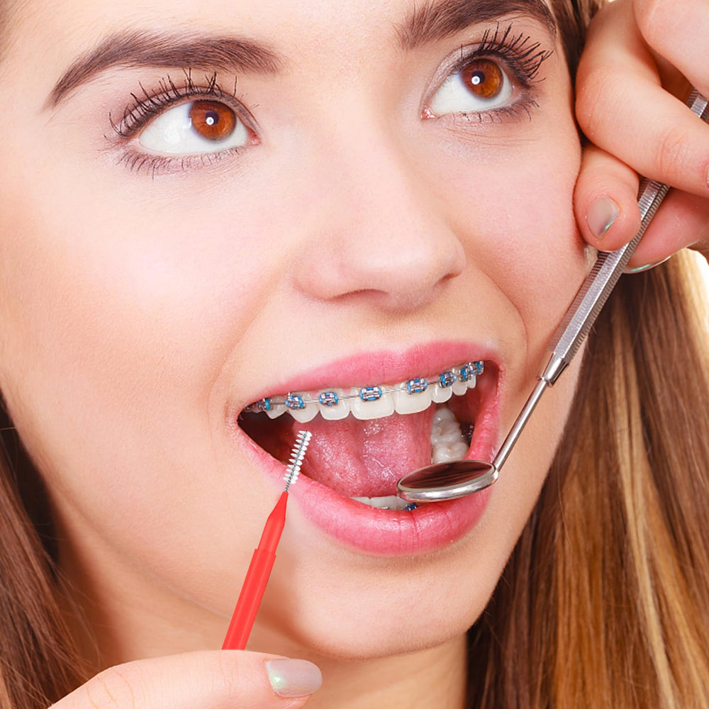 Brush heads designed to clean between braces and implants