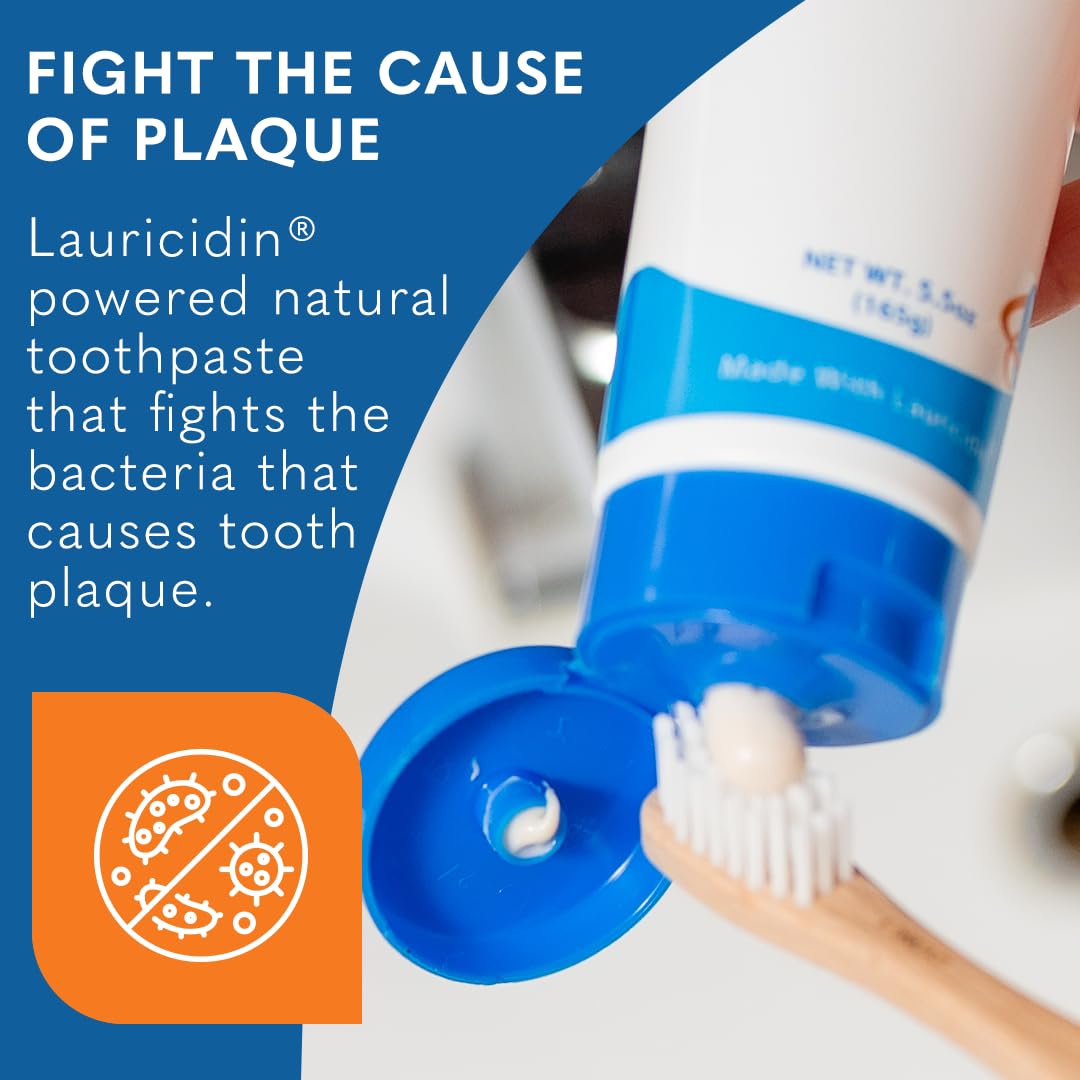 Toothbrush with a dab of Lauricidin toothpaste showing minty texture