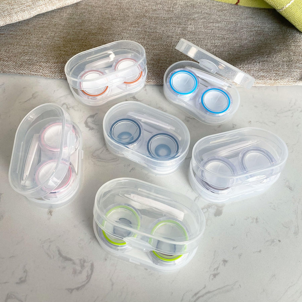 Six candy-colored contact lens cases for travel and home