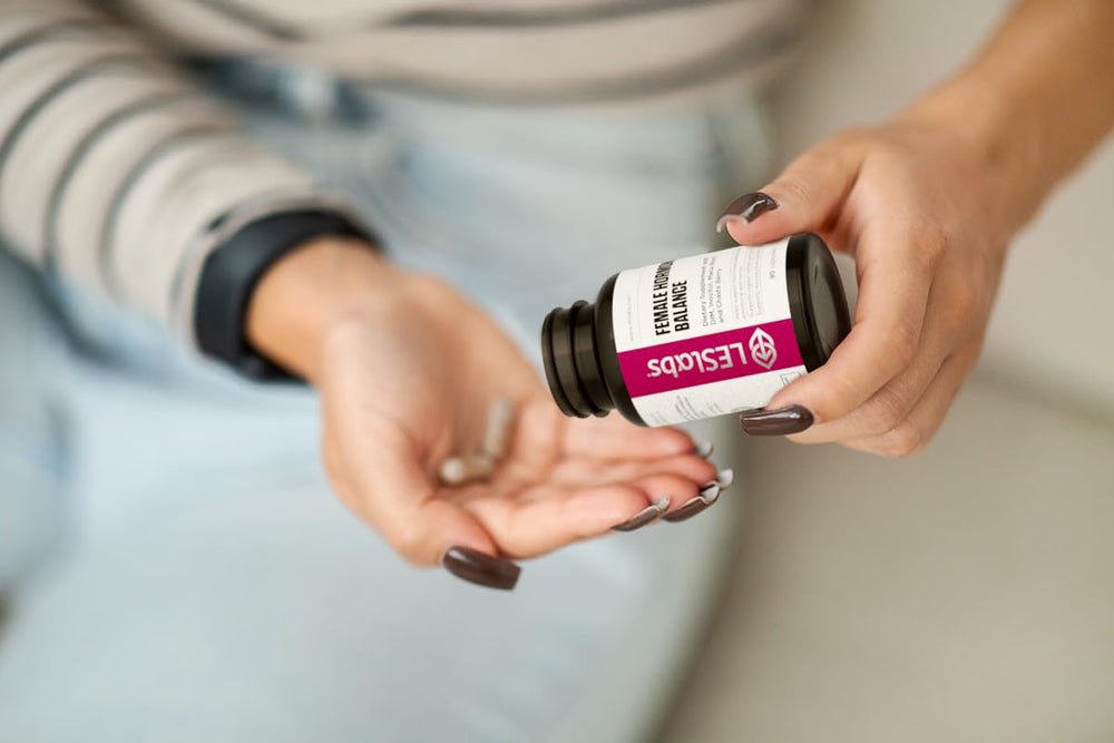 Fertility and menstrual cycle wellness concept with capsules