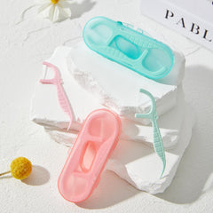 Four mini travel floss cases included in the kit