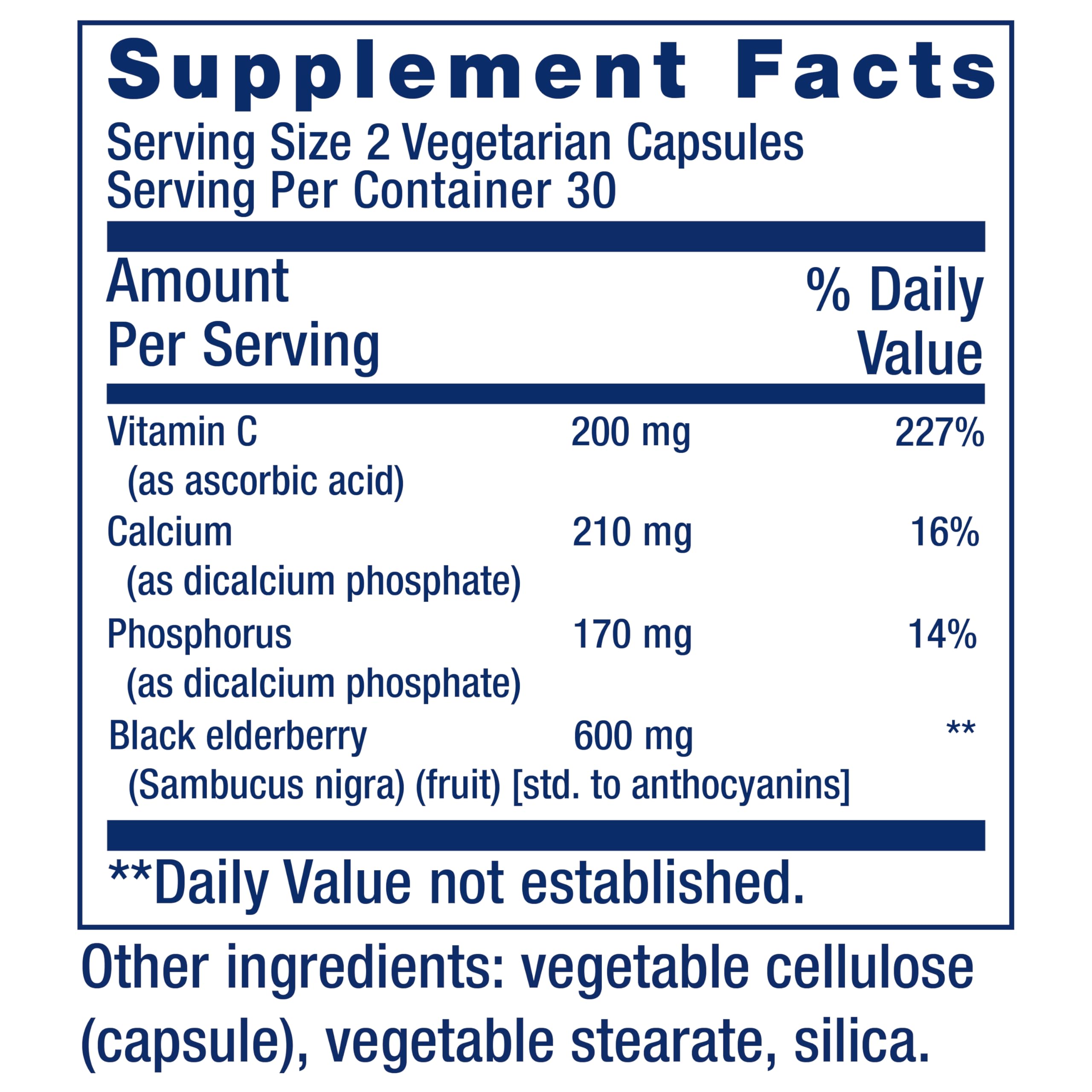 Close-up of elderberries and vitamin C tablets