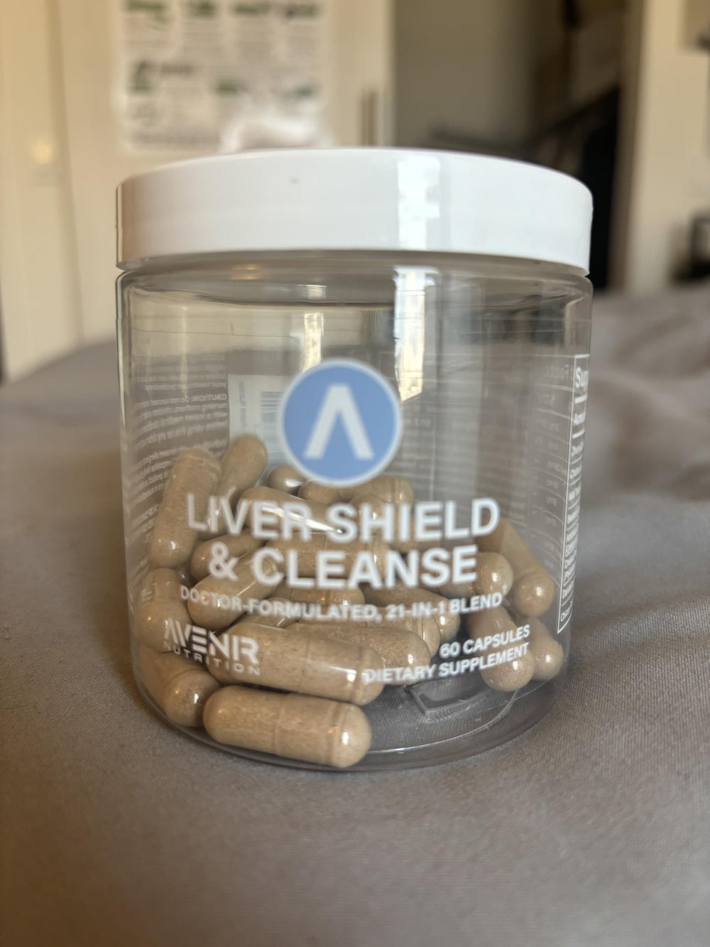 Lifestyle image of a man and woman taking Liver Shield & Cleanse