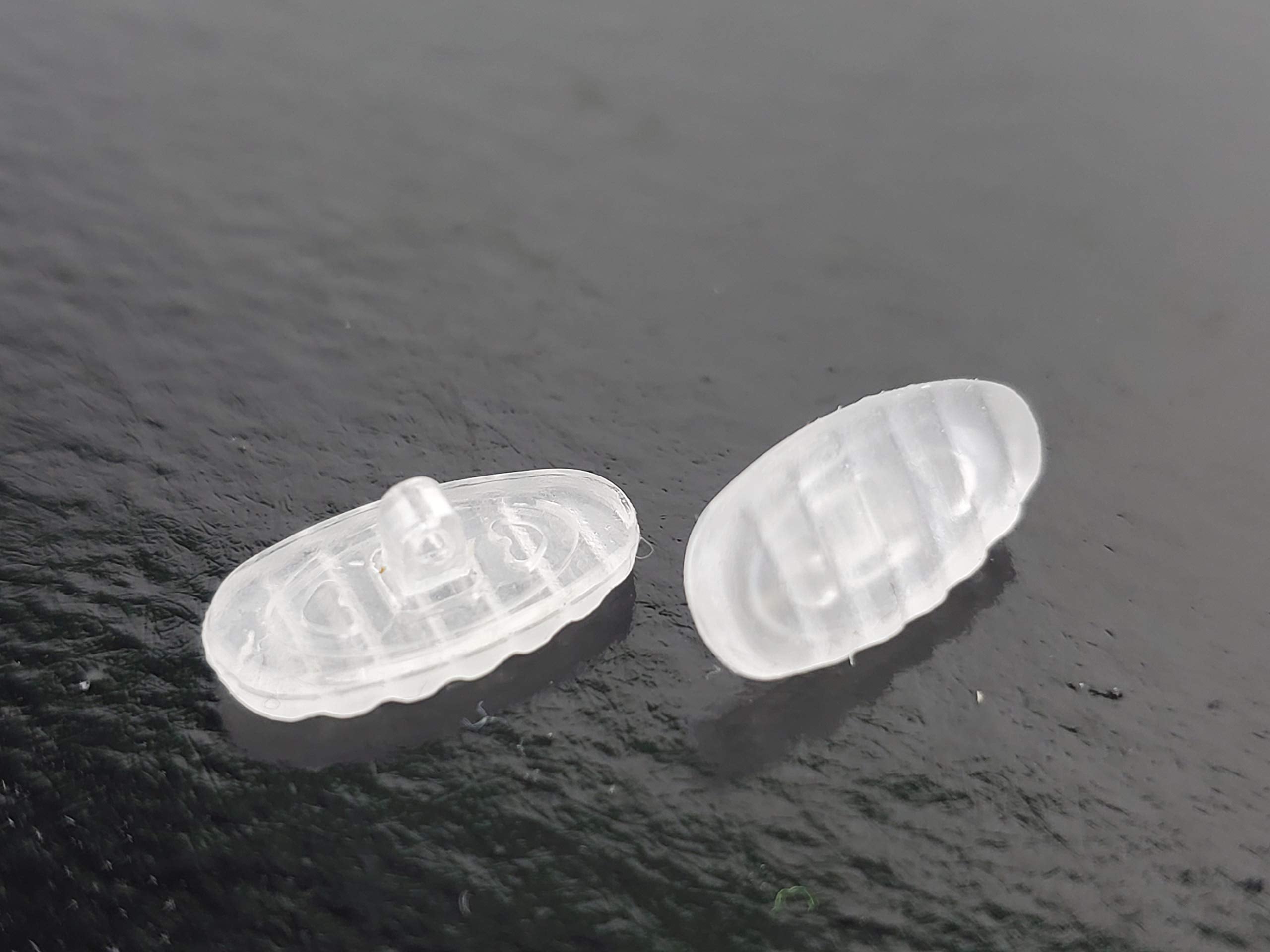 Nose pads installed on glasses showing non-slip ridged design