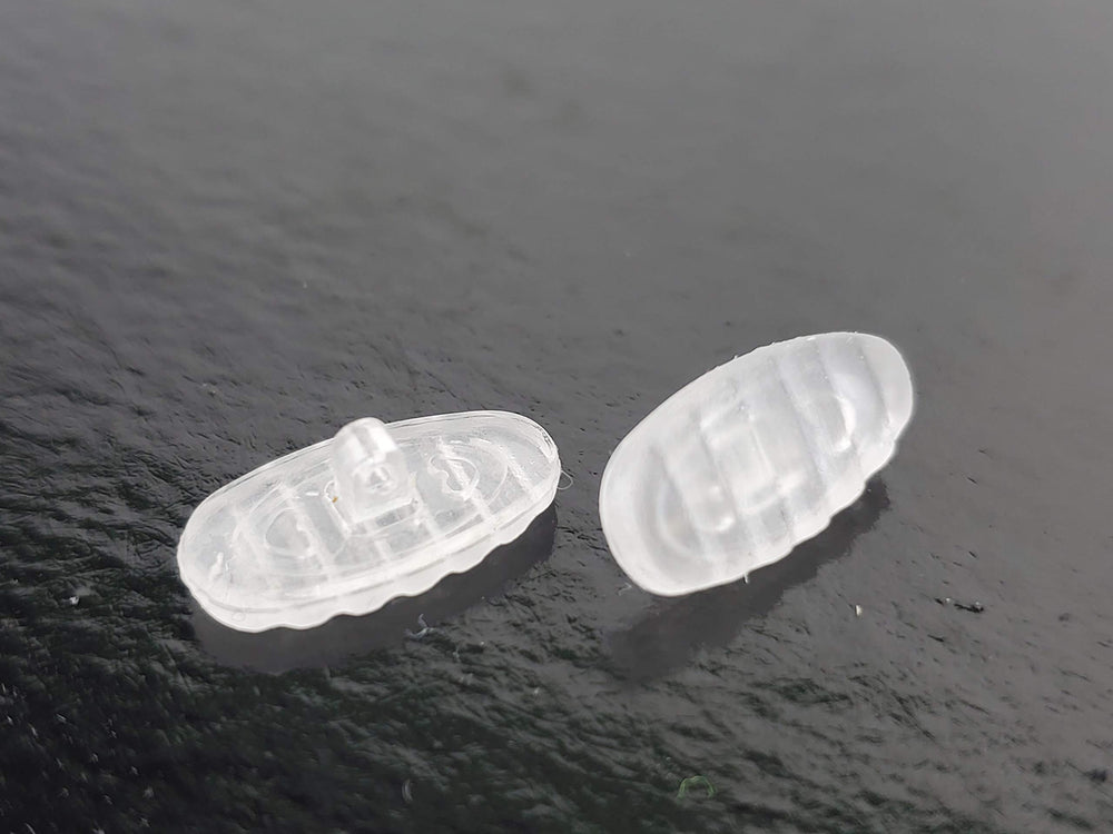 Nose pads installed on glasses showing non-slip ridged design