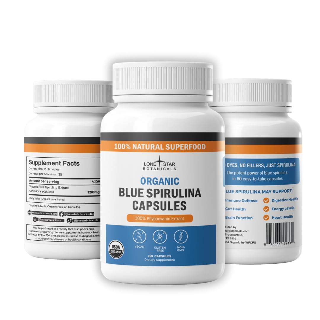 Blue spirulina capsules in a bottle, side view