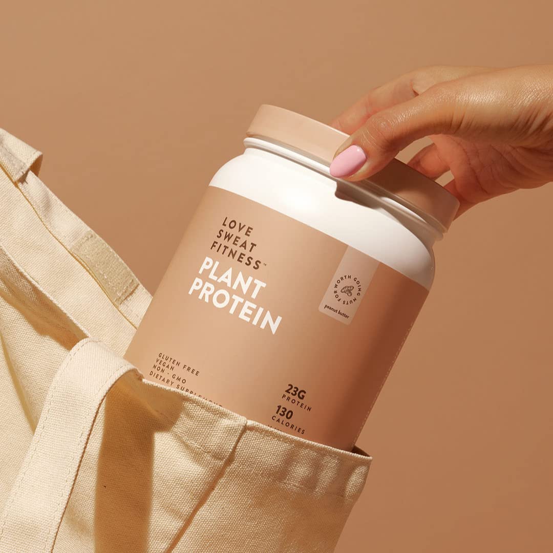 Love Sweat Fitness vegan protein bottle being poured into a glass