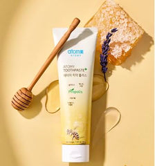 Close-up of toothpaste tube with propolis, xylitol, and green tea extract
