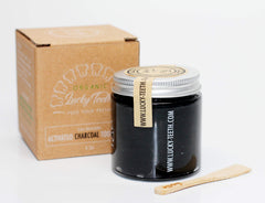 Front view of Lucky Teeth Charcoal Toothpaste Xtra Whitening in a glass bottle