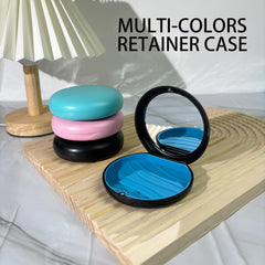 Opened case showing built-in mirror and hinge