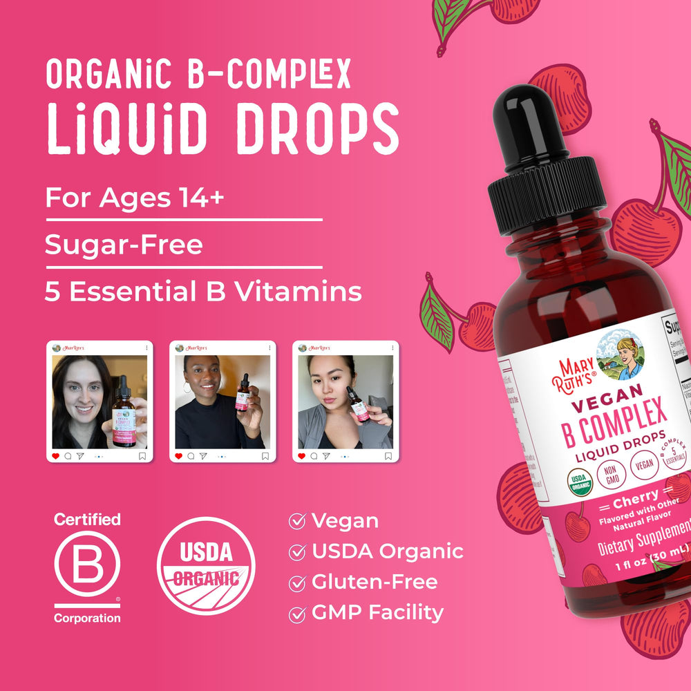 Cherry-flavored liquid B Complex drops bottle near glass