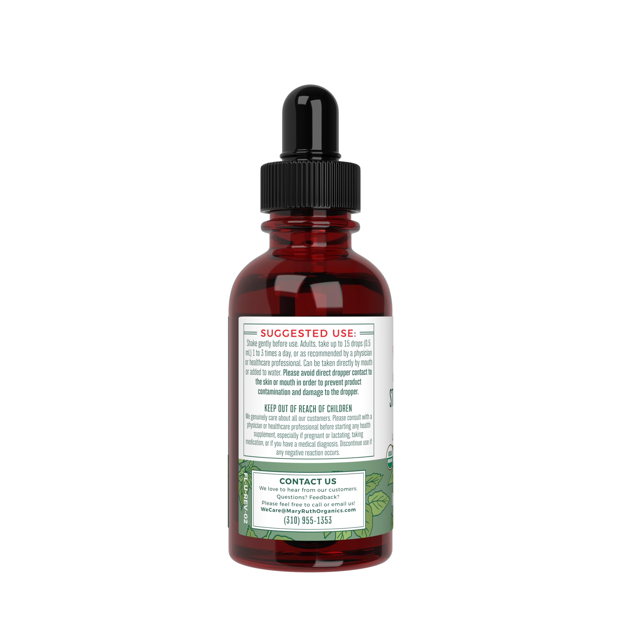Dropper dispensing nettle tincture into a glass