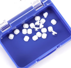 Mesh base lingual button designed for easy bonding