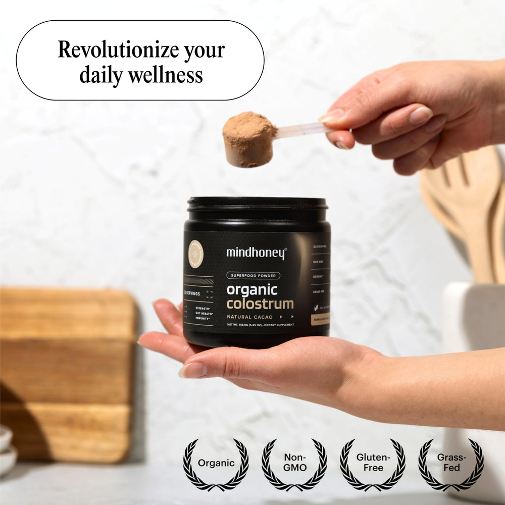 Glass with dissolved cacao flavored colostrum powder