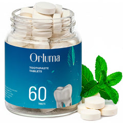 Mint toothpaste tablets in a travel-size jar