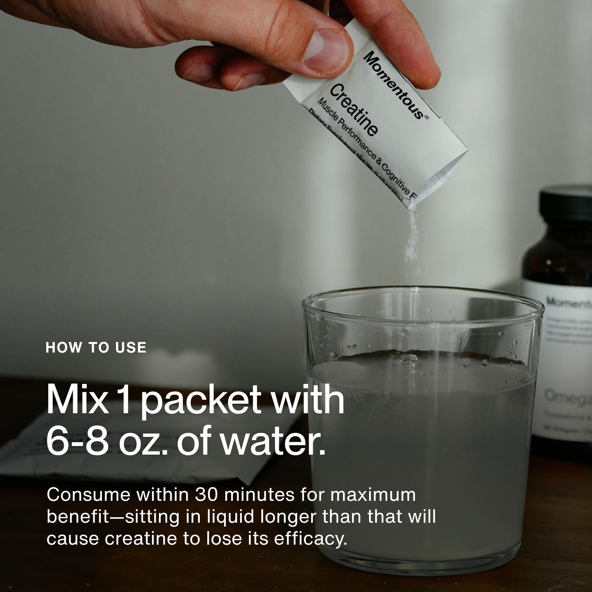 Powder being mixed with Momentous Creatine Monohydrate