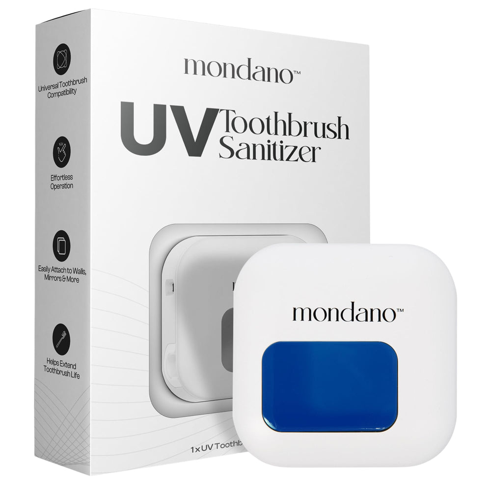 Mondano UV-C toothbrush sanitizer and wall-mount holder mounted on a bathroom wall