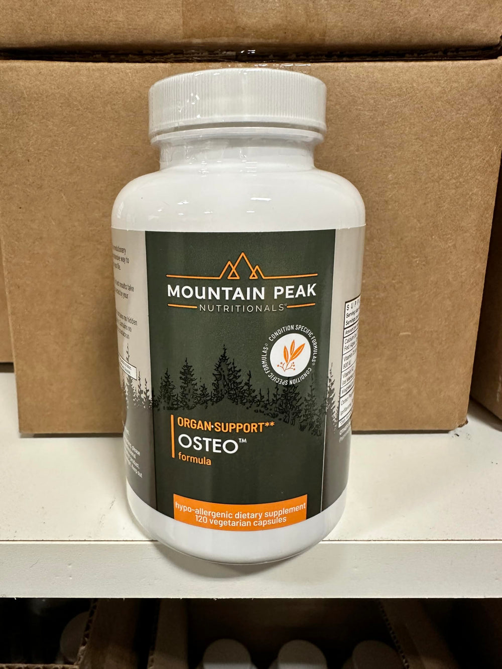 Osteo supplement bottle with boxes and tablets