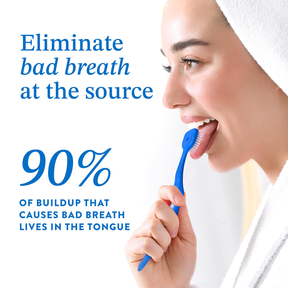 Travel-friendly tongue cleaner with protective cap stored in a toiletry bag.