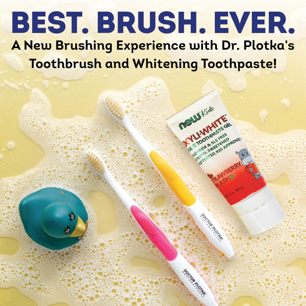 Close-up of soft dual-layer bristles on a yellow toothbrush